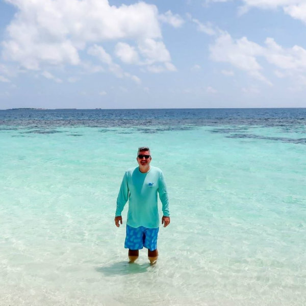 David Zapata standing in the water at the beach